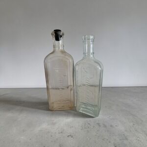 Vintage WT Rawleigh Co Glass Medicine Bottles Embossed Apothecary Set of 2 Clear